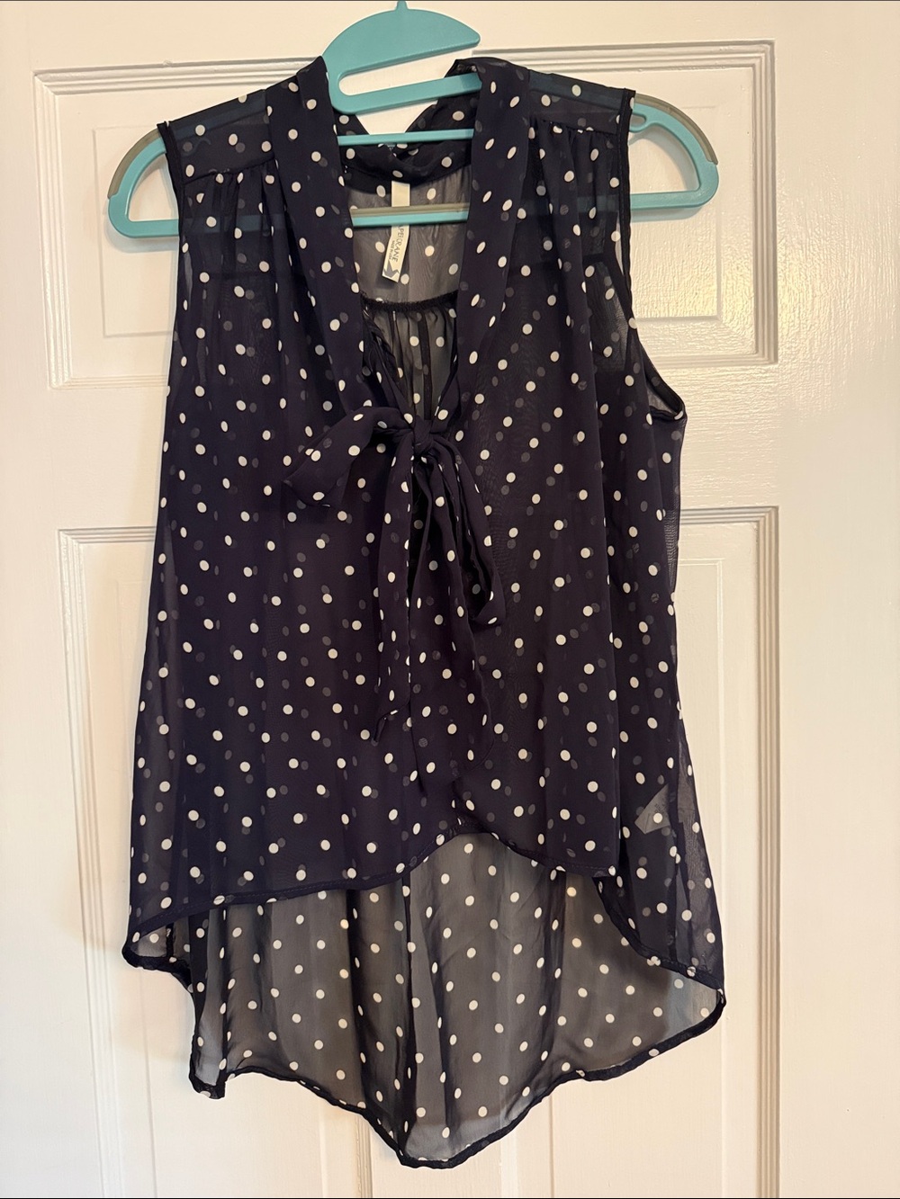 Sleeveless Navy Polka Dot Tie-Neck Blouse